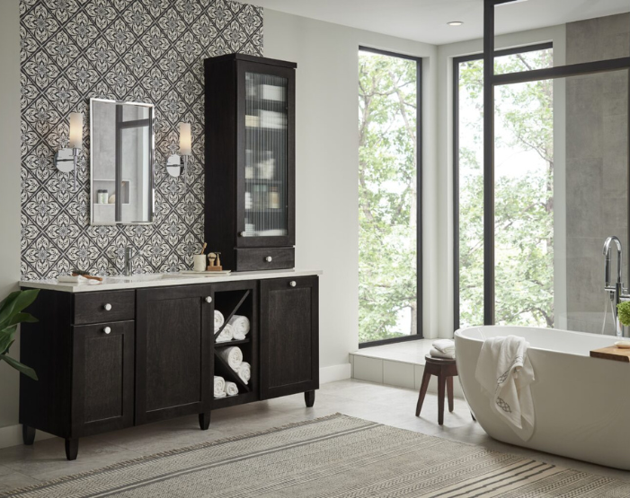 Modern bathroom vanity with gray cabinetry, gold hardware, dual sinks, patterned tiles, dual mirrors, and elegant illuminated lighting for a sophisticated look.