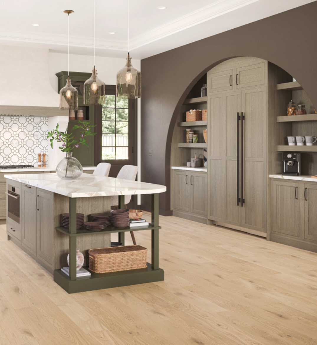 light wood-look flooring in a kitchen with built in brown cabinetry